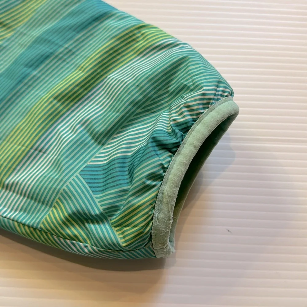 The North Face reversible puffers jacket.  Green, yellow, white swirl. Girls XL